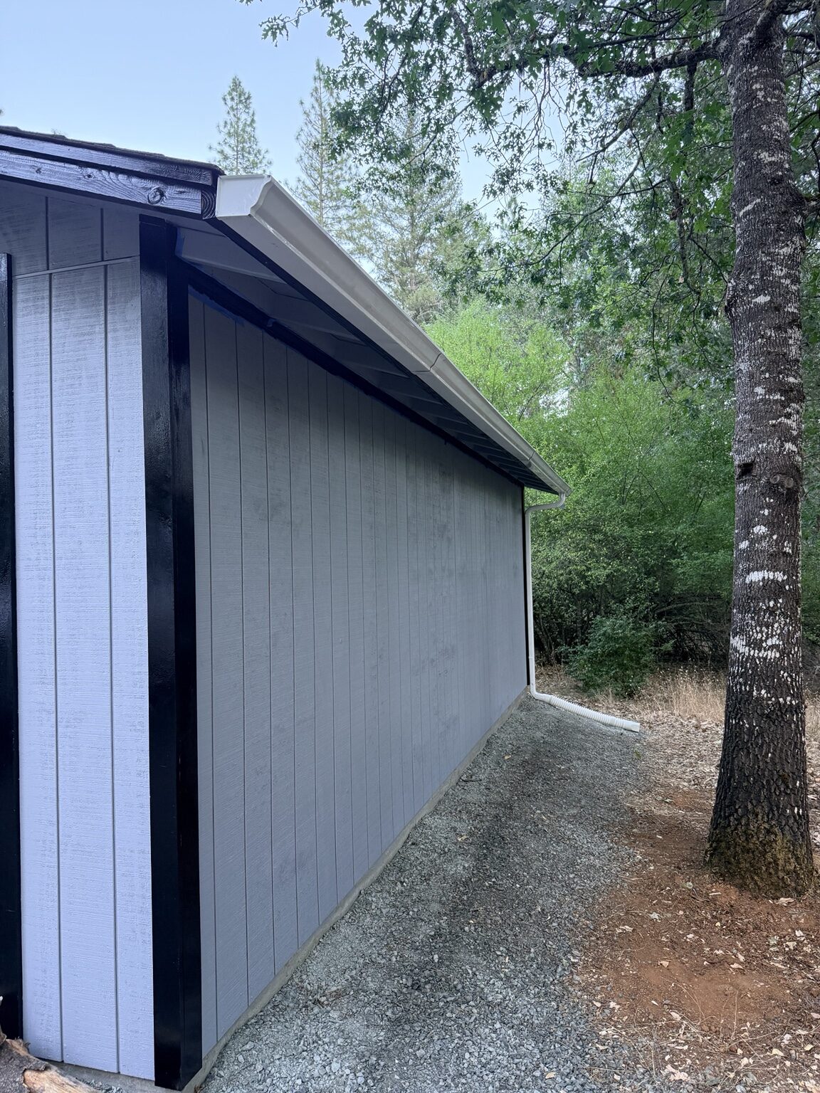 Downspout discharge routed away from the foundation
